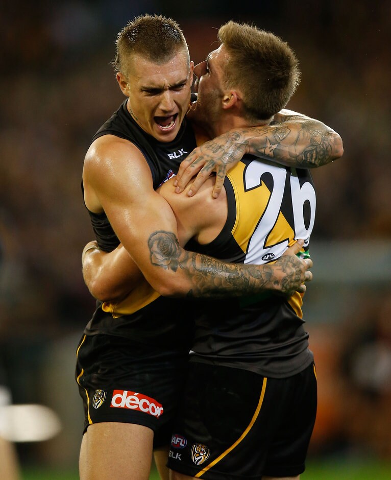AFL 2016 Rd 01 - Richmond v Carlton MELBOURNE, AUSTRALIA - MARCH 24: Dustin Martin (left) and Anthony Miles of the Tigers celebrate during the 2016 AFL Round 01 match between the Richmond Tigers and the Carlton Blues at the Melbourne Cricket Ground, Melbourne on March 24, 2016. (Photo by Michael Willson/AFL Media)